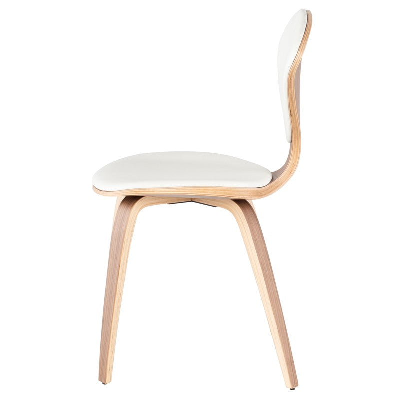 Chair
Ideal for small spaces, the Satine dining chair features a wood-veneer frame, contrasted against a leather seat and back. Curvy and exuberant, this chair's completeEdge Decor Satine Dining Chair